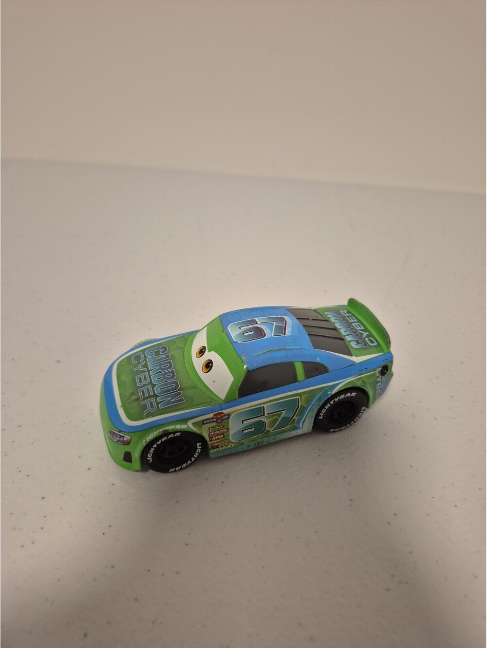 Disney Pixar Cars Bobby Roadtesta #67 Carbon Cyber Pull Back 1:43 Disney Store
